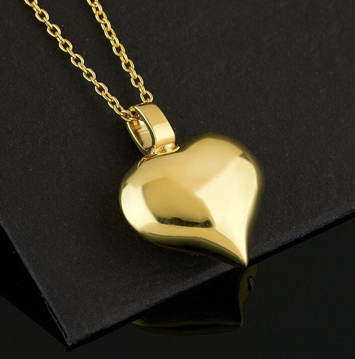 Gold heart-shaped pendant on a chain necklace for 14K Gold Cremation Heart Jewelry