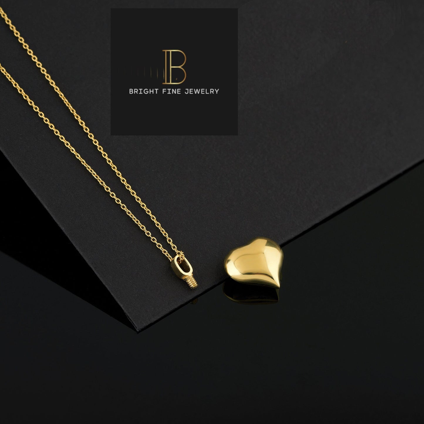 Gold cremation heart pendant on a delicate chain for memorializing loved ones