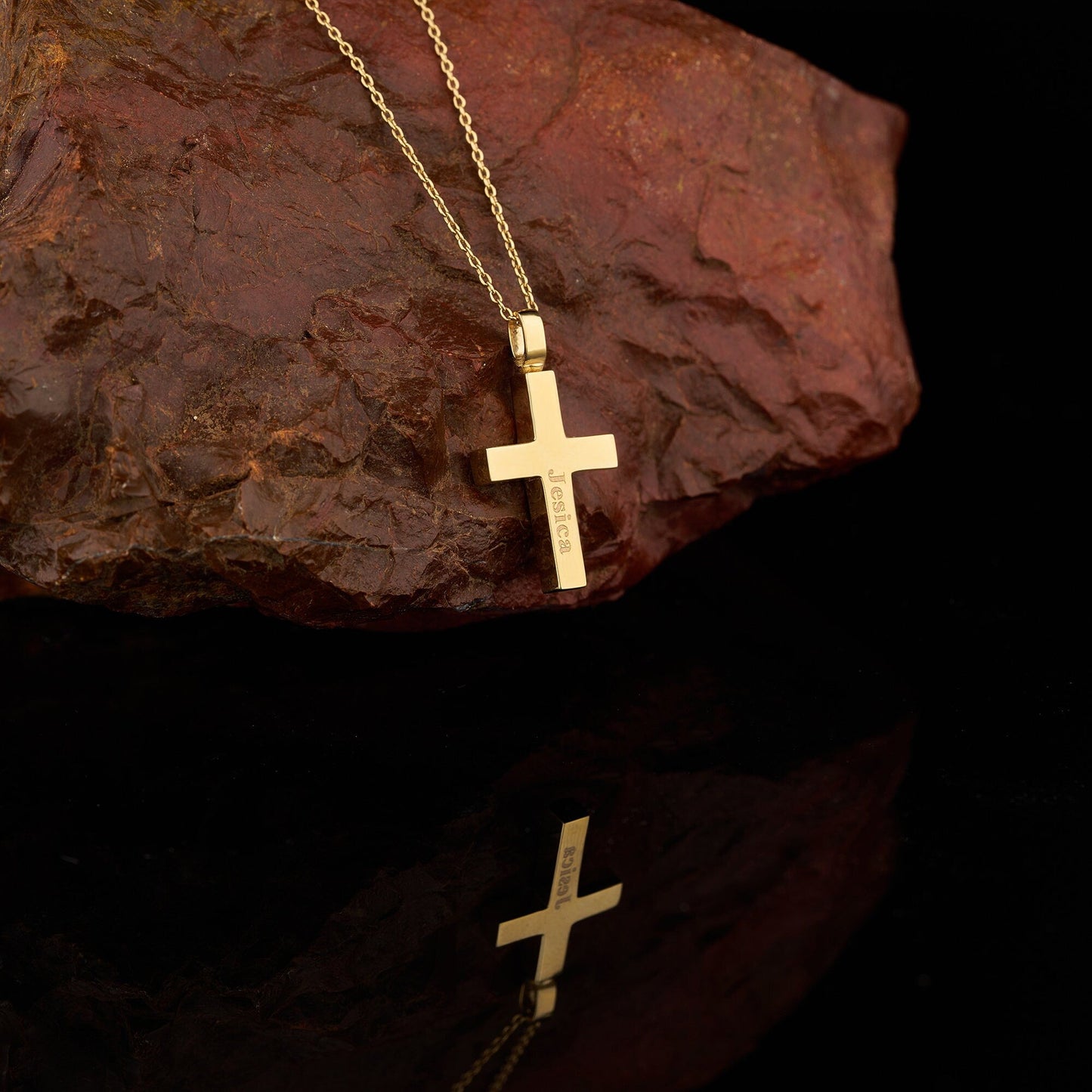 Gold cross pendant on a delicate chain in a personalized cremation urn necklace