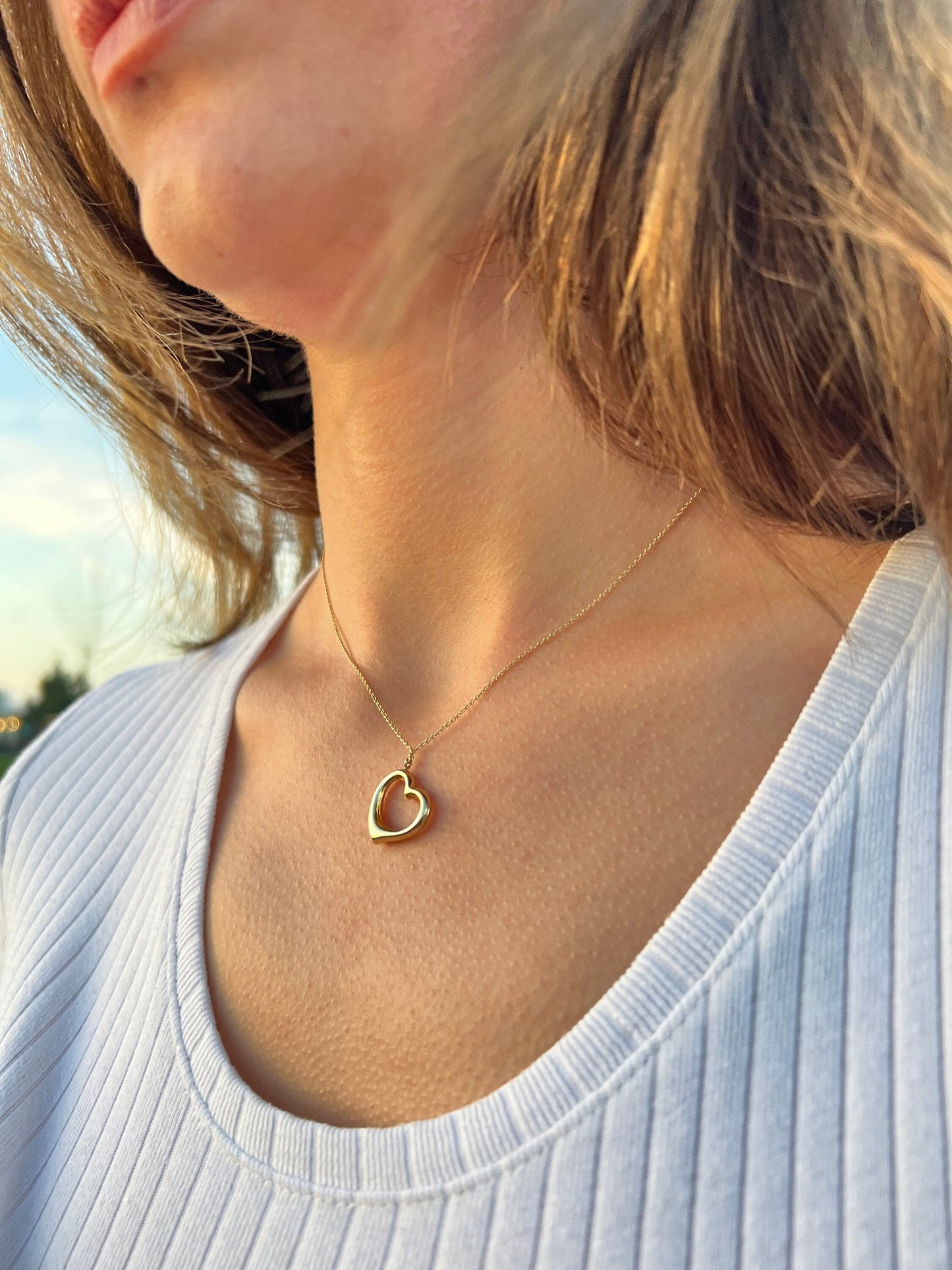 Delicate 14K Solid Gold Heart Pendant Necklace on a thin chain showcasing elegance
