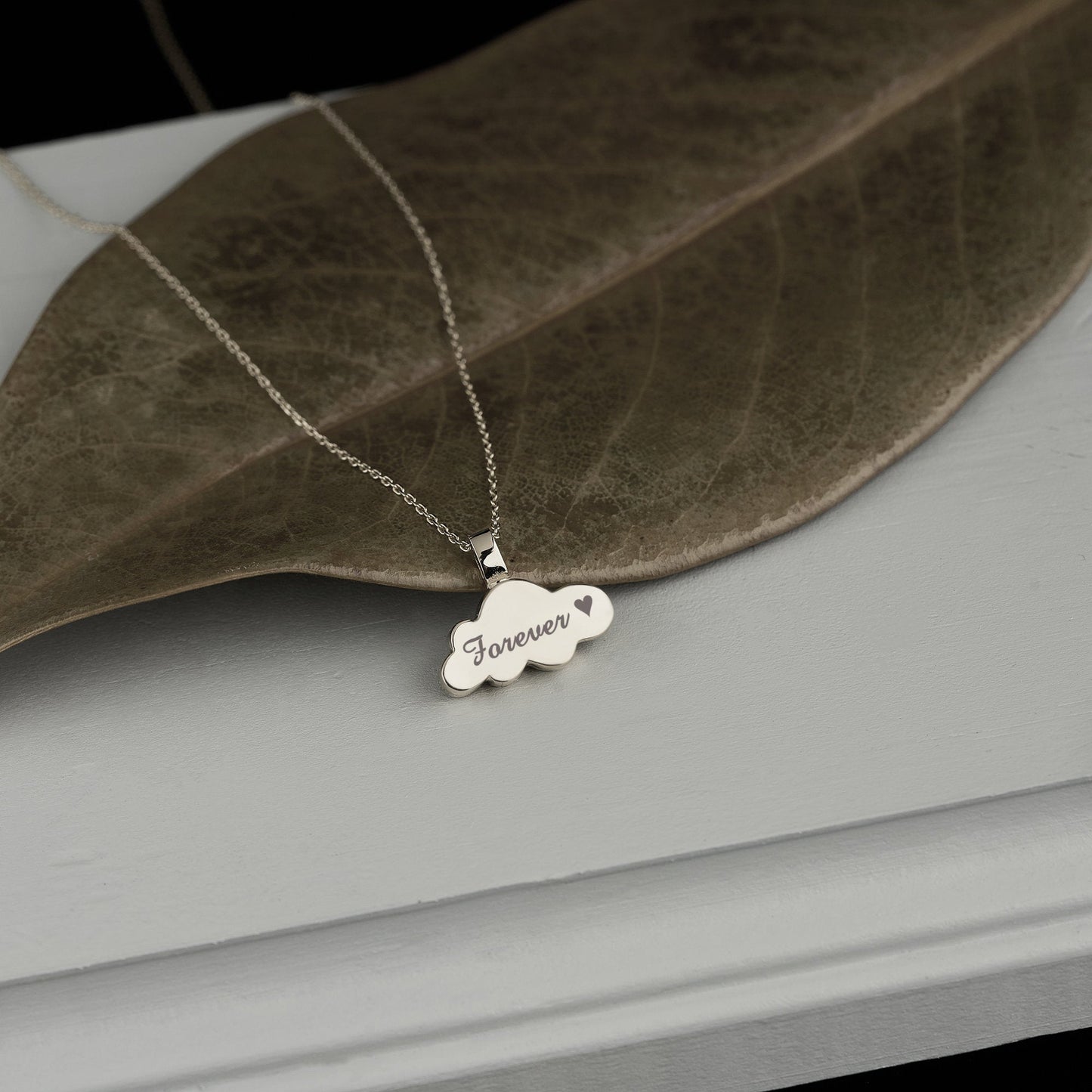 Silver cloud urn necklace with Forever engraving, part of the Gold Cloud Urn collection