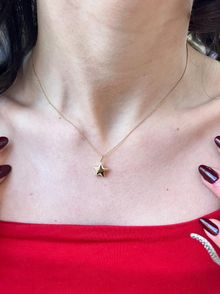 Gold star pendant necklace on delicate chain, crafted from 14K solid gold, ideal star necklace