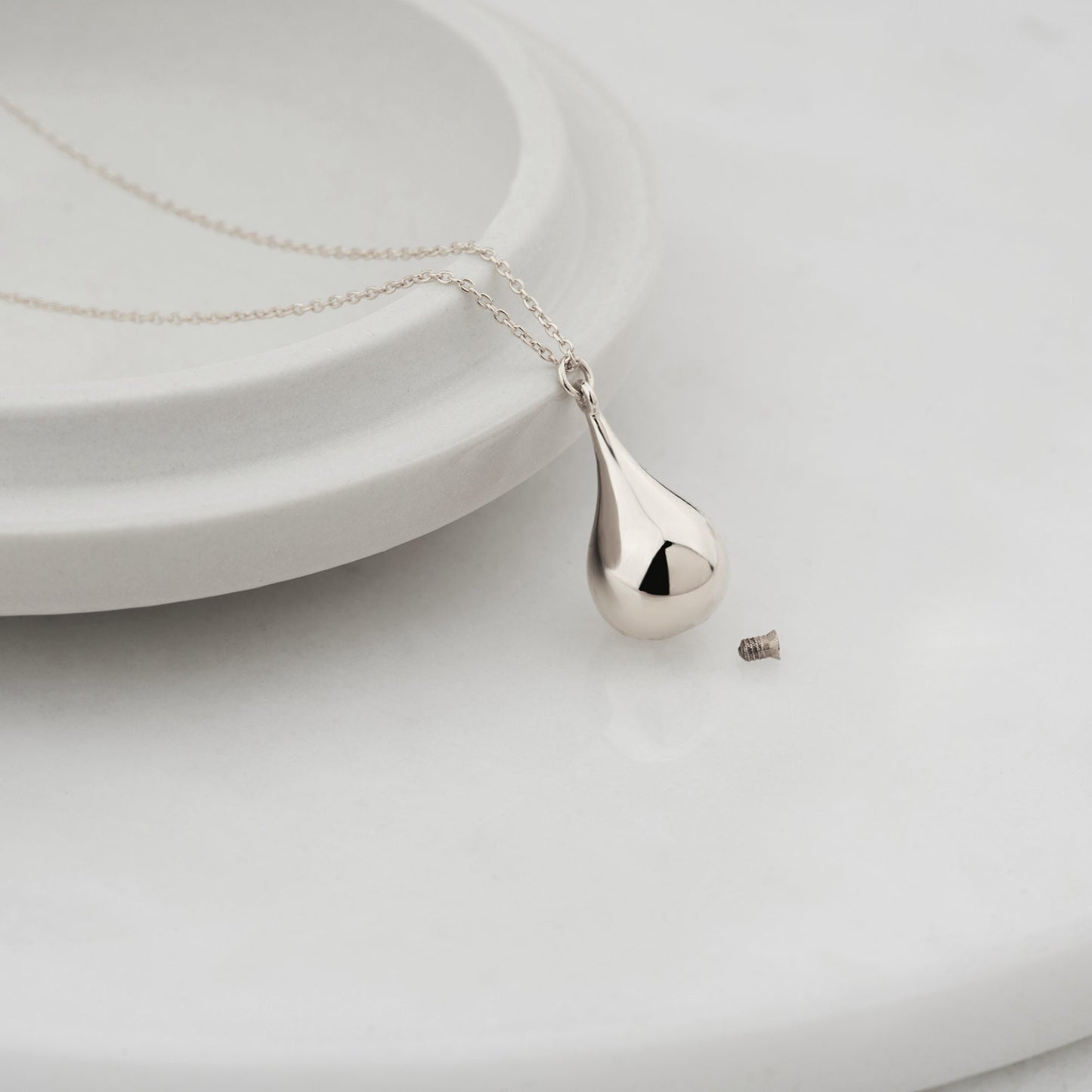 Silver teardrop pendant on a delicate chain, perfect for a cremation urn necklace