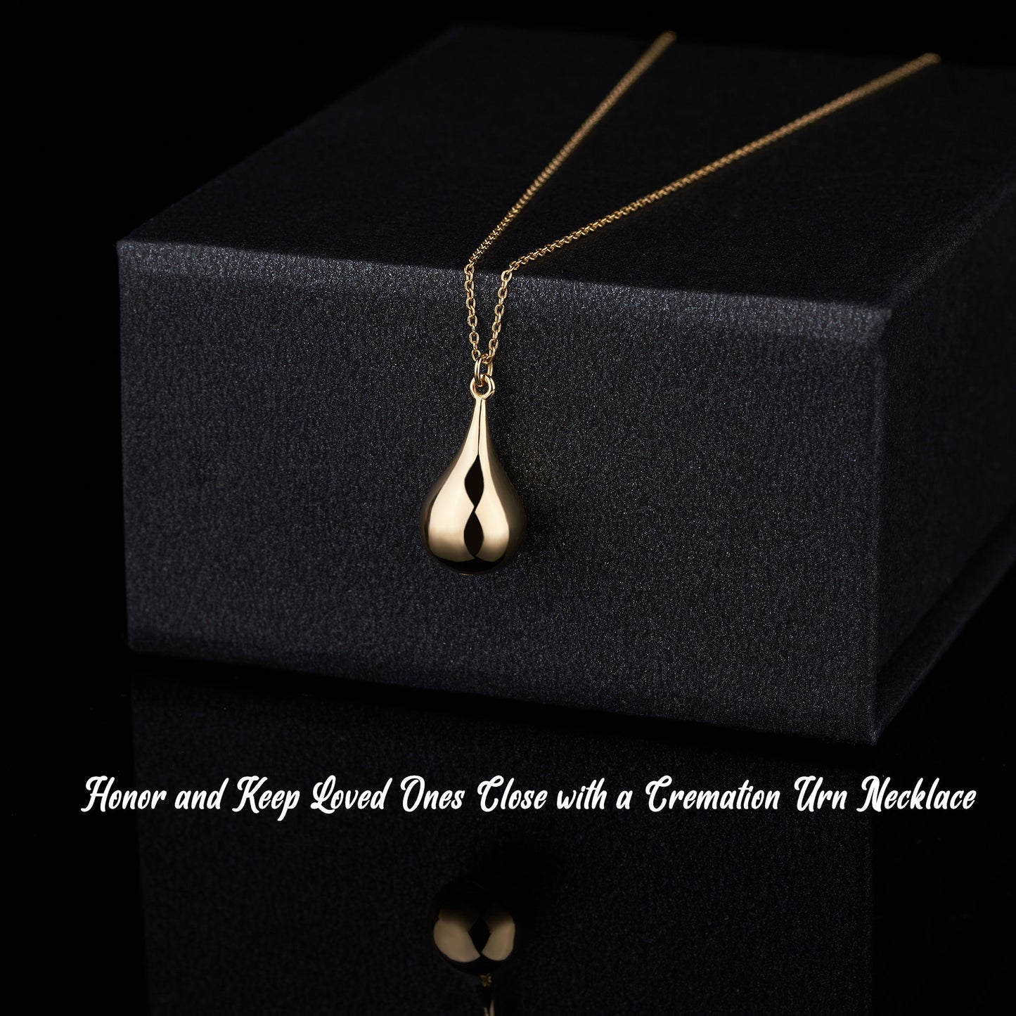 Gold teardrop cremation urn pendant on a delicate chain, a unique urn necklace