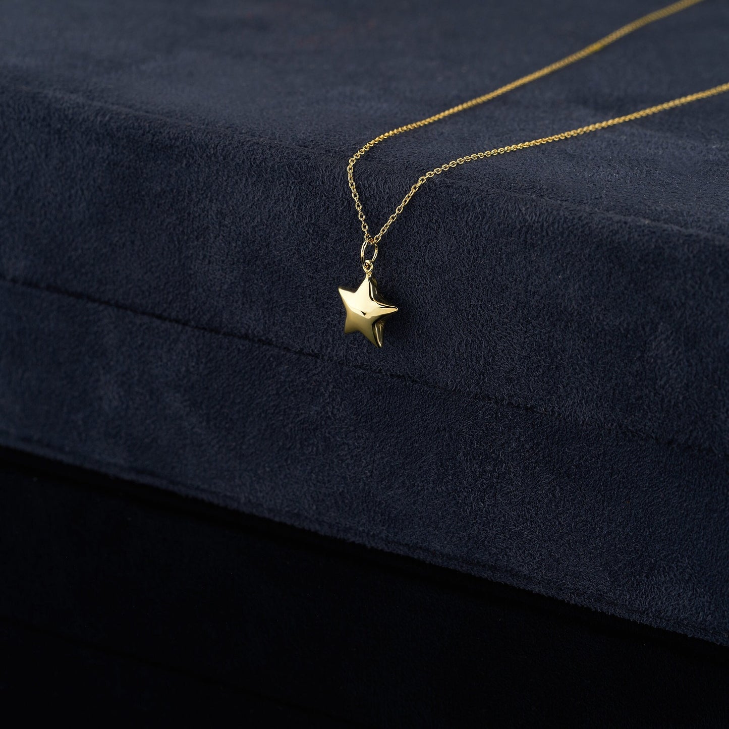 Gold star pendant necklace on a delicate chain in 14K solid gold design