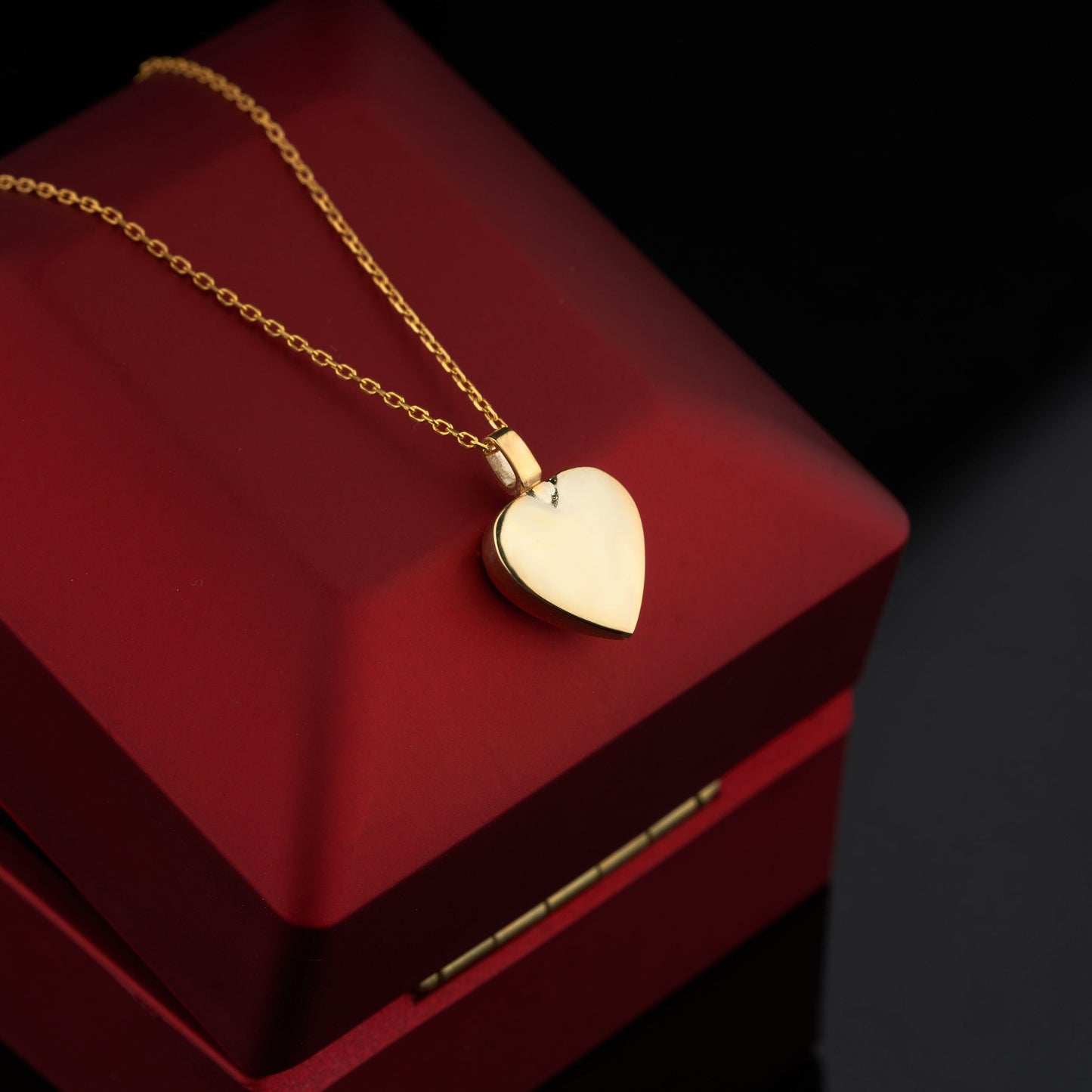 Solid Gold Mom & Dad Heart Urn Necklace with a delicate chain and gold heart pendant