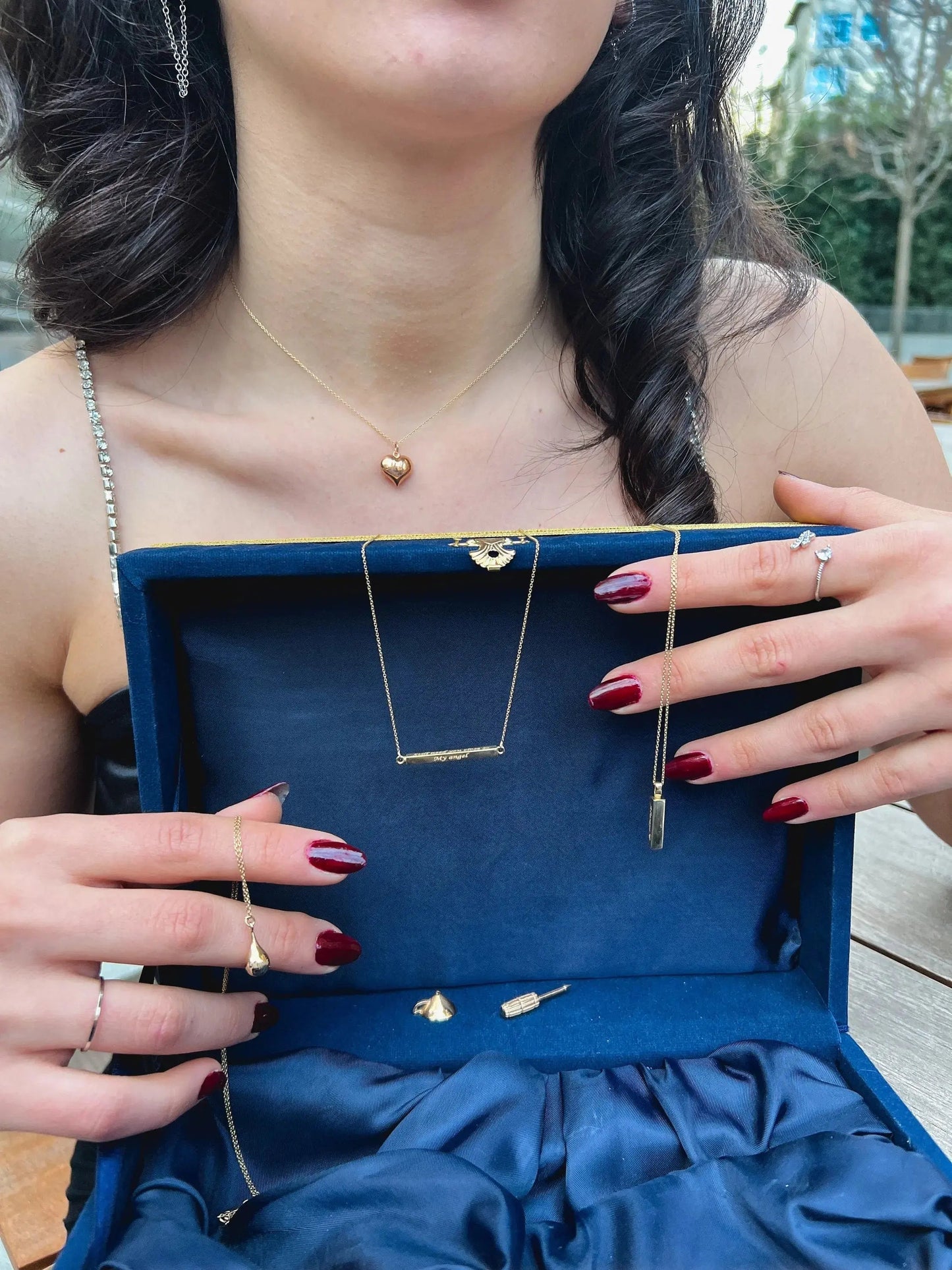 Royal blue velvet jewelry box showcasing personalization cremation urn necklace with gold necklaces