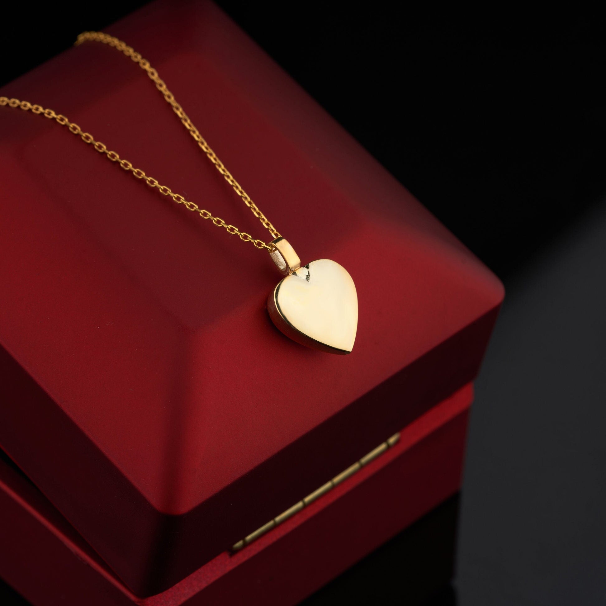 Solid Gold Mom & Dad Heart Urn Necklace with a delicate chain and gold heart pendant