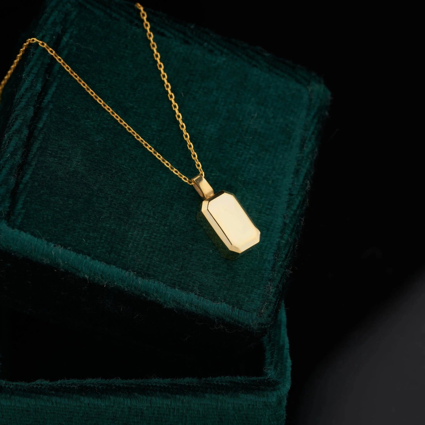 Gold pendant necklace with rectangular charm, part of the 14K Gold Urn Necklace collection