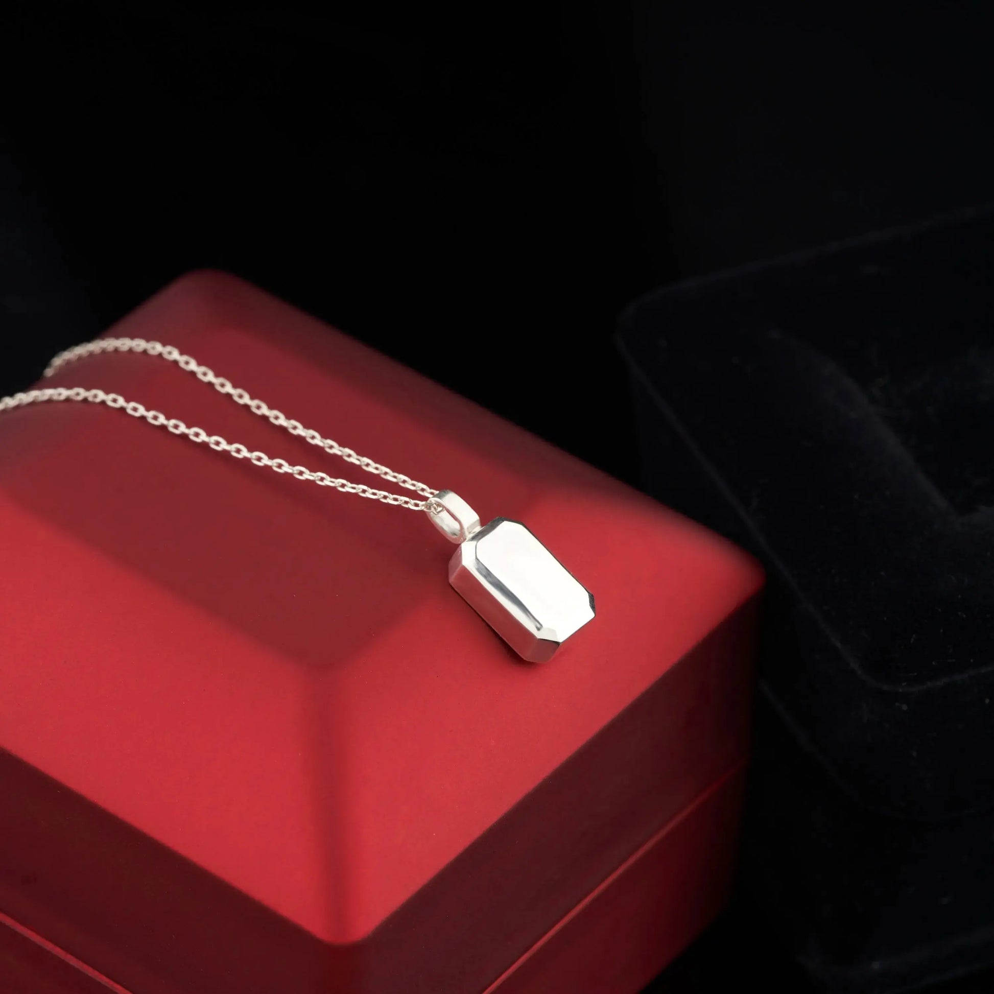 Silver urn necklace with rectangular charm on delicate chain, personalized memorial jewelry