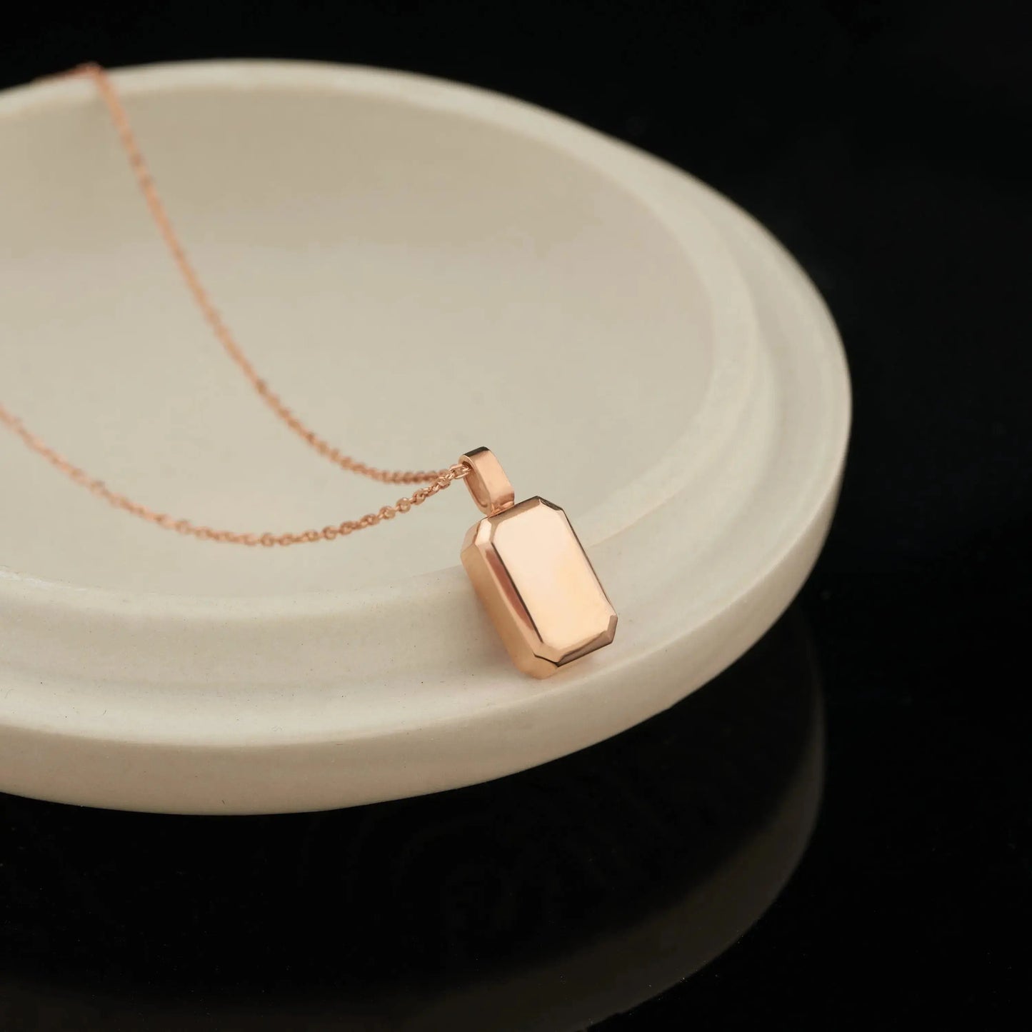 Rose gold geometric pendant necklace on delicate chain, a stunning urn necklace for personalized memorial