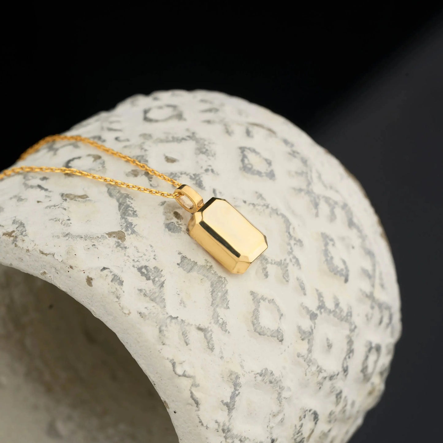 Gold-plated urn necklace featuring a rectangular charm on a delicate chain, perfect for personalized memorials