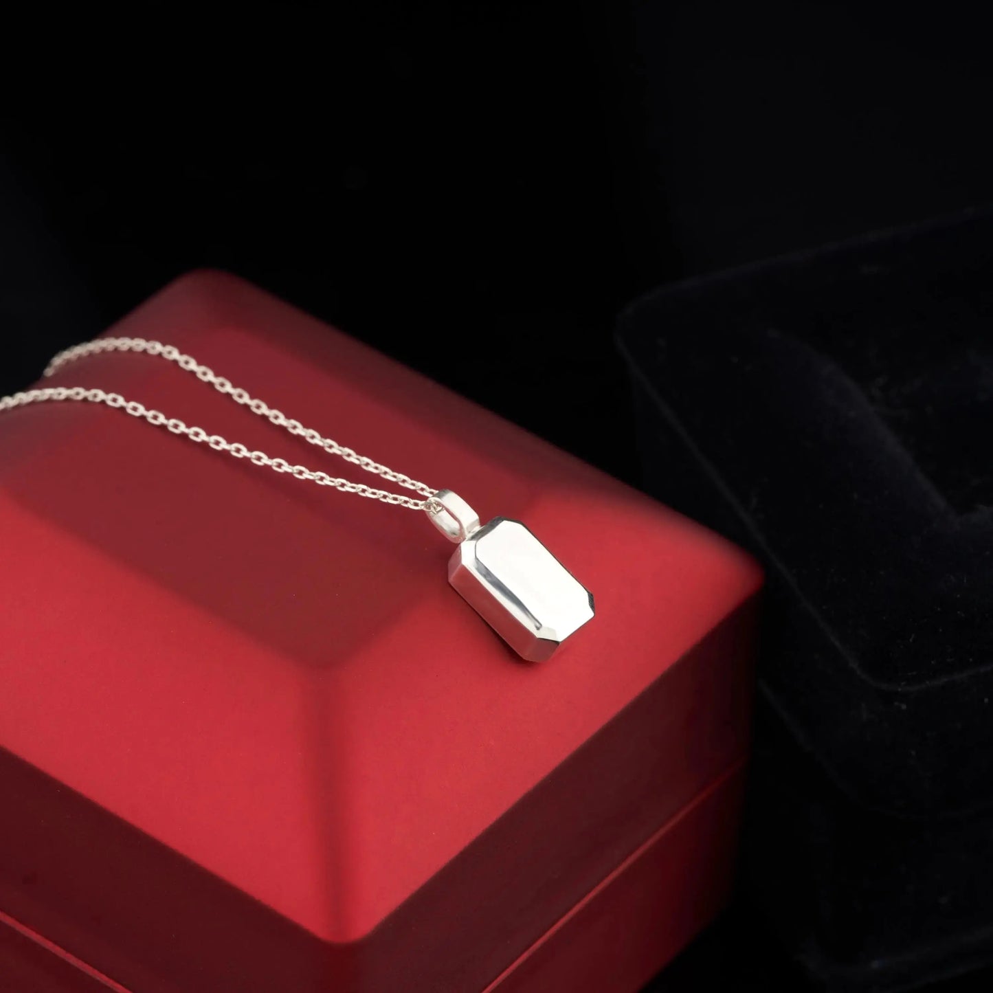 Silver urn necklace with rectangular charm on delicate chain, custom engraved cremation jewelry