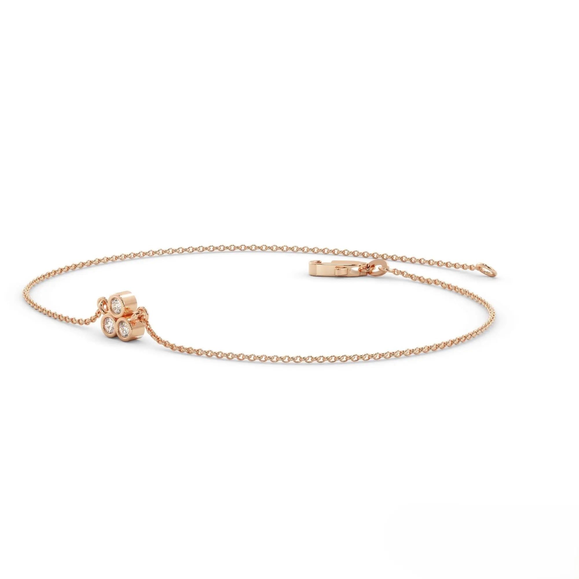 Delicate rose gold chain bracelet with flower charm in a gold diamond bracelet design