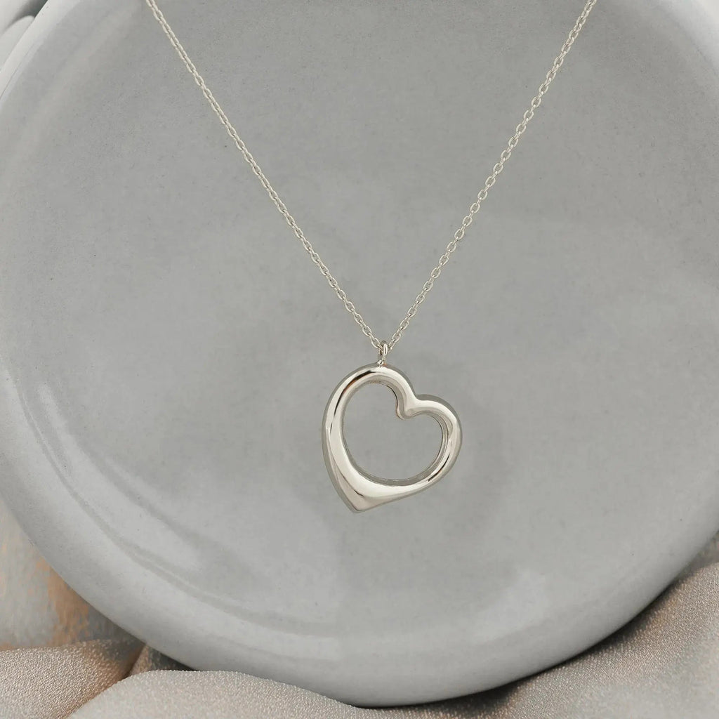 Silver heart pendant on a delicate chain necklace in 14K solid gold, elegant handmade jewelry