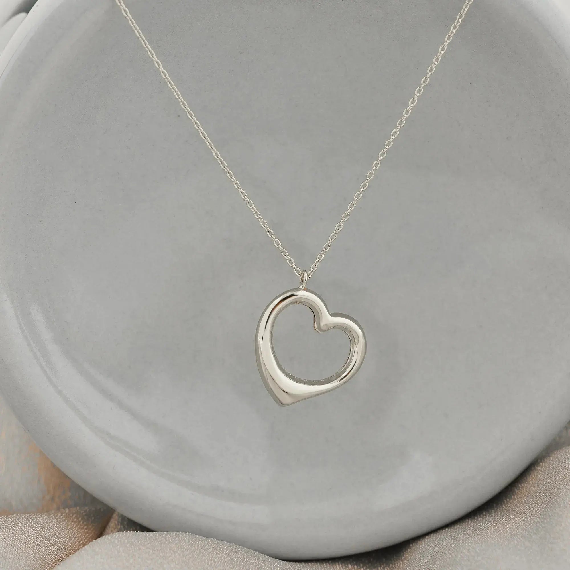 Silver heart pendant on a delicate chain necklace in 14K solid gold, elegant handmade jewelry