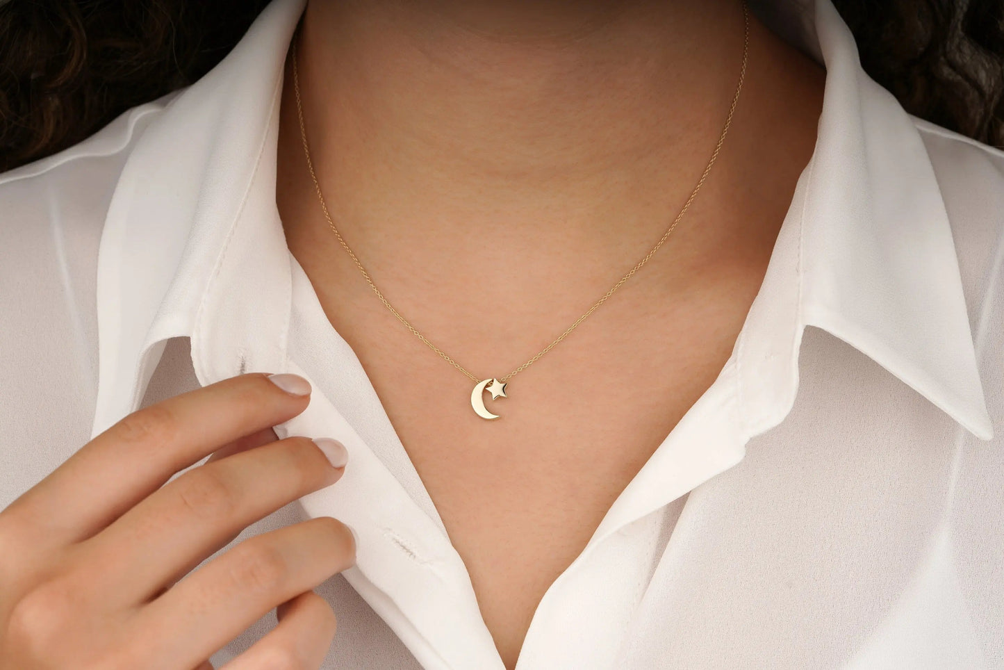 Delicate 14K Moon Star Necklace featuring a gold crescent pendant on a white collar
