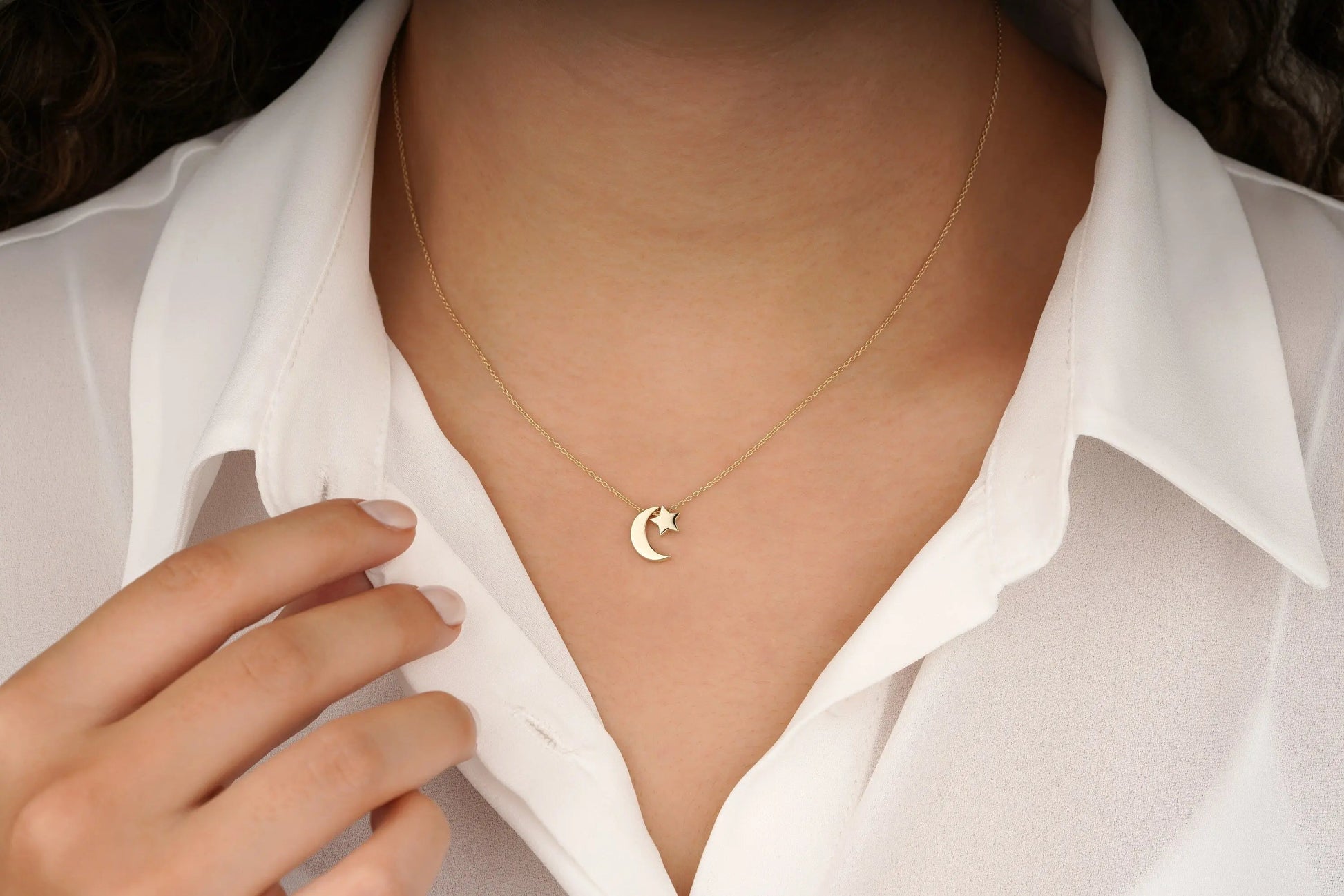 Delicate 14K Moon Star Necklace featuring a gold crescent pendant on a white collar