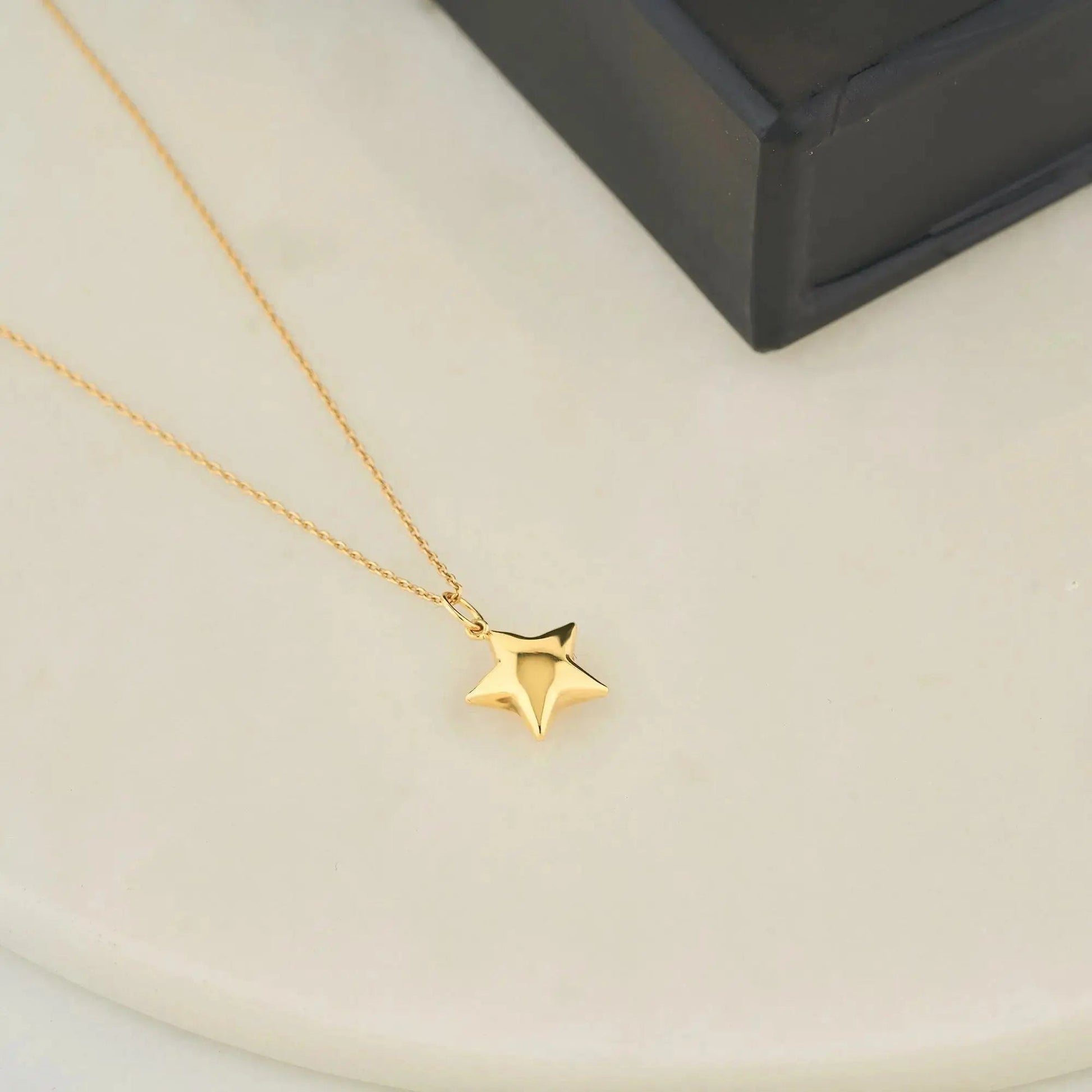 Gold star pendant necklace on delicate chain, crafted from 14K solid gold, elegant star necklace