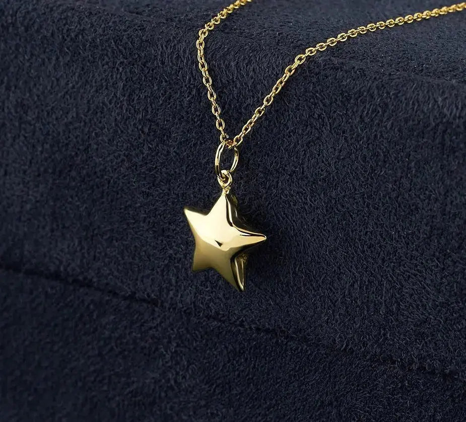 Gold star pendant on a delicate chain in 14K Solid Gold Star Necklace design