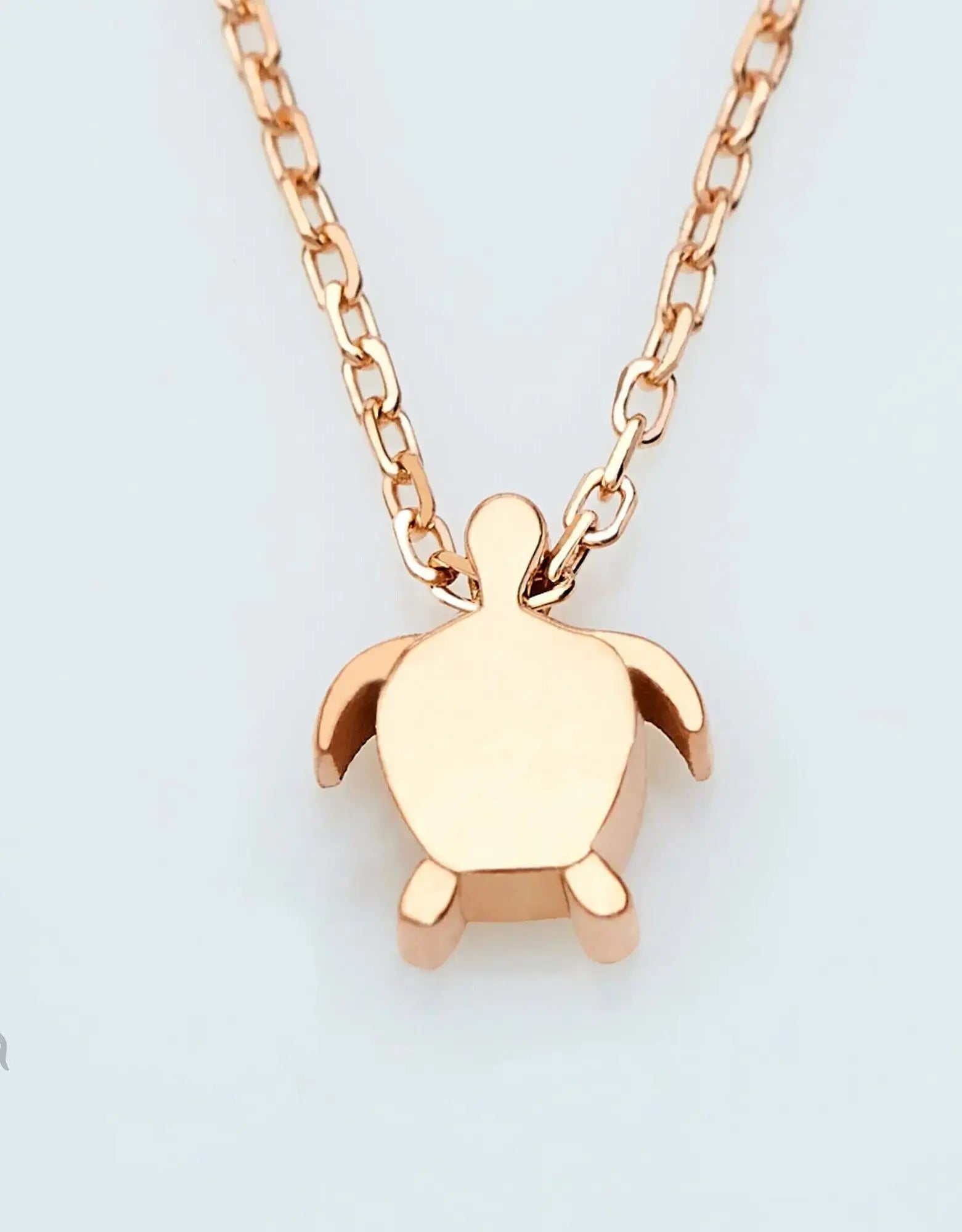 Rose gold turtle pendant necklace on a chain, part of the 14K Gold Tiny Sea Turtle Jewelry
