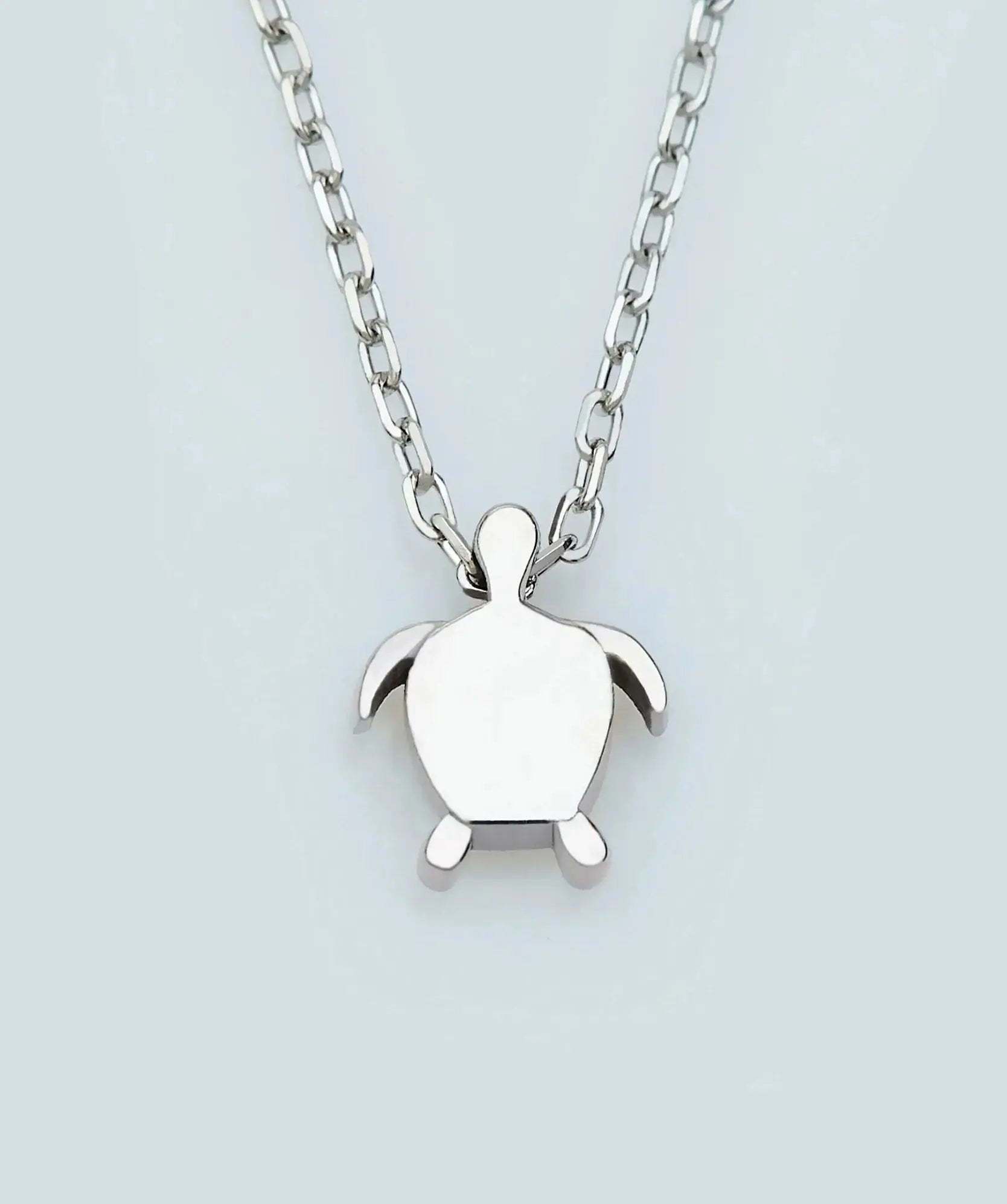 Silver turtle pendant on a chain necklace in 14K Gold Tiny Sea Turtle Necklace design