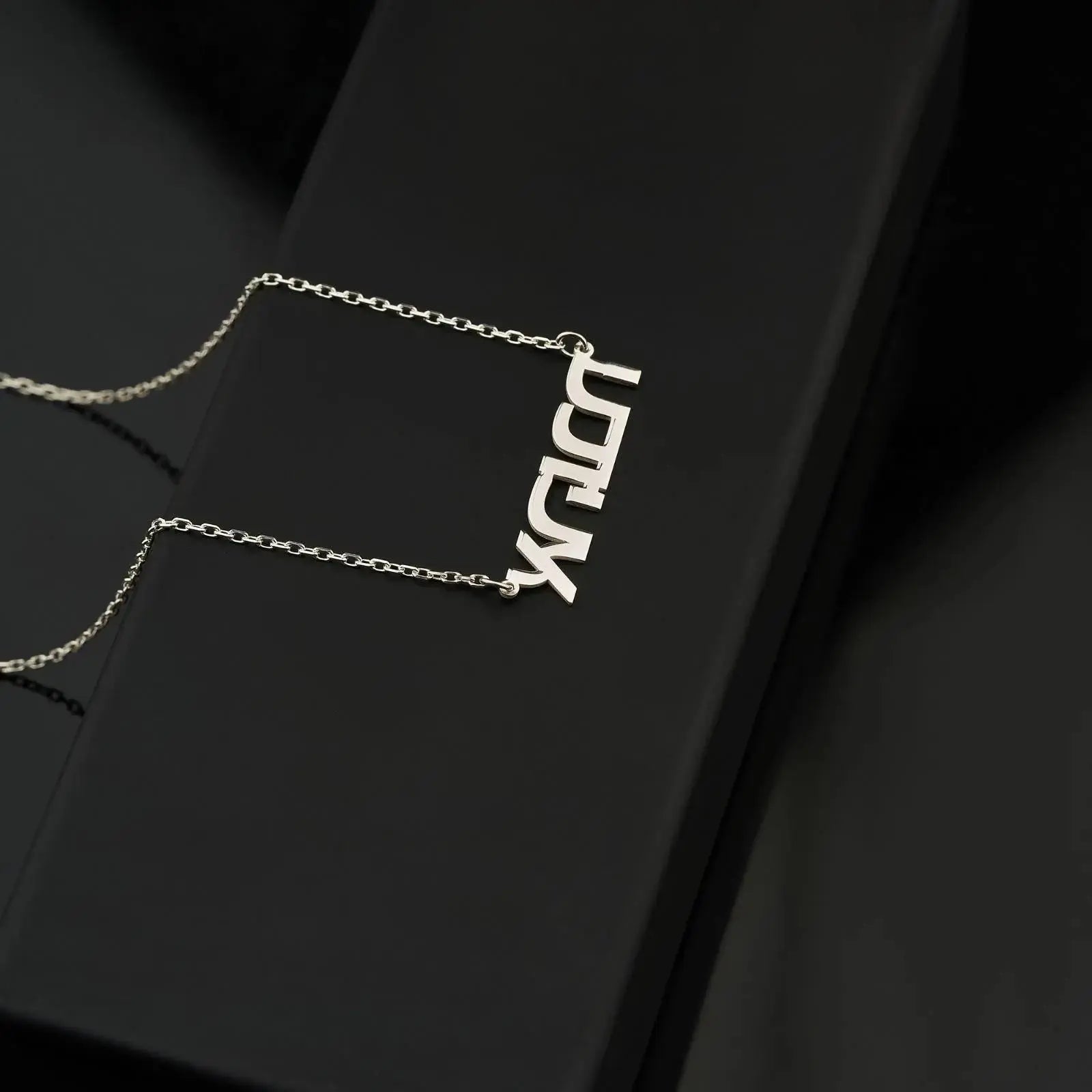 Silver personalized Tamil pendant necklace with LUCK text on a stylish chain