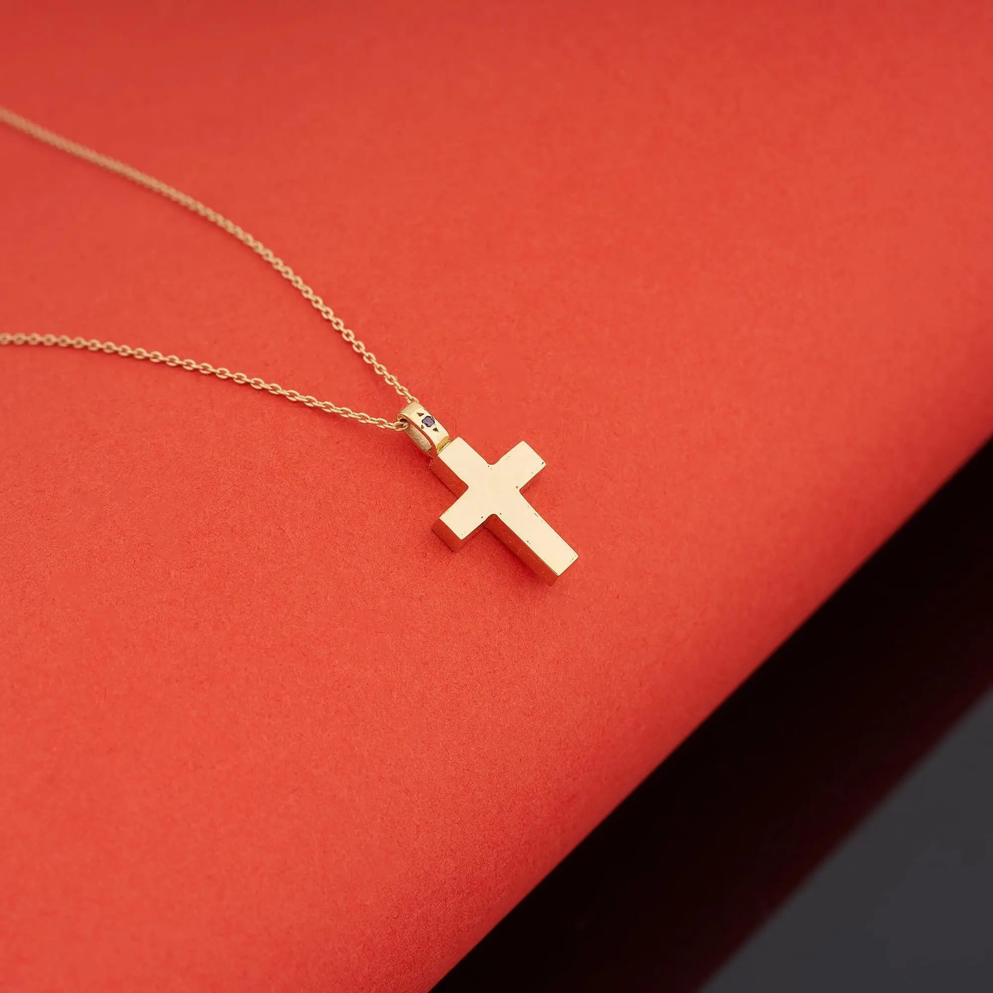 Solid gold cross urn necklace styled on model