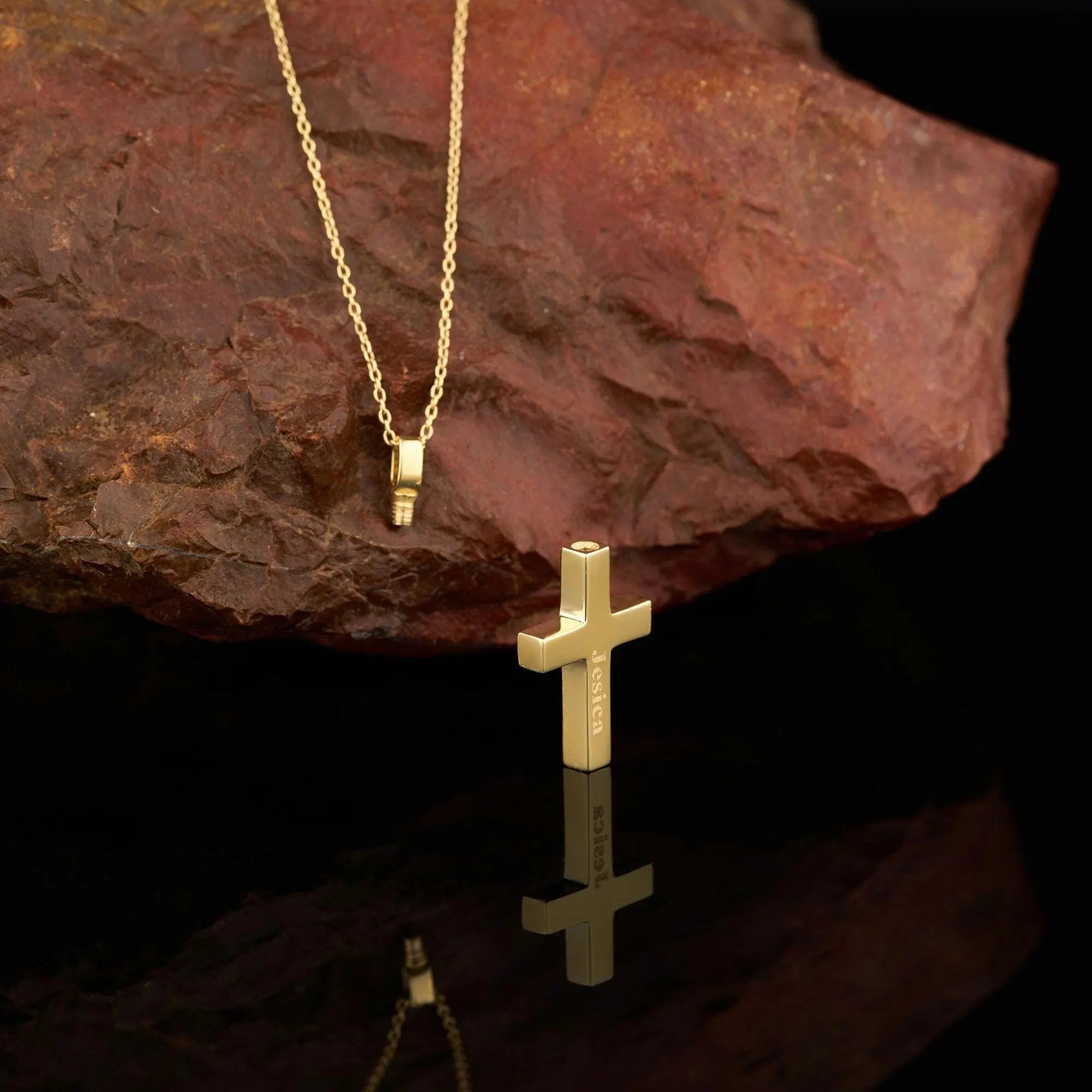 Gold cross pendant on a delicate chain of the Engraved Cross Cremation Urn Necklace