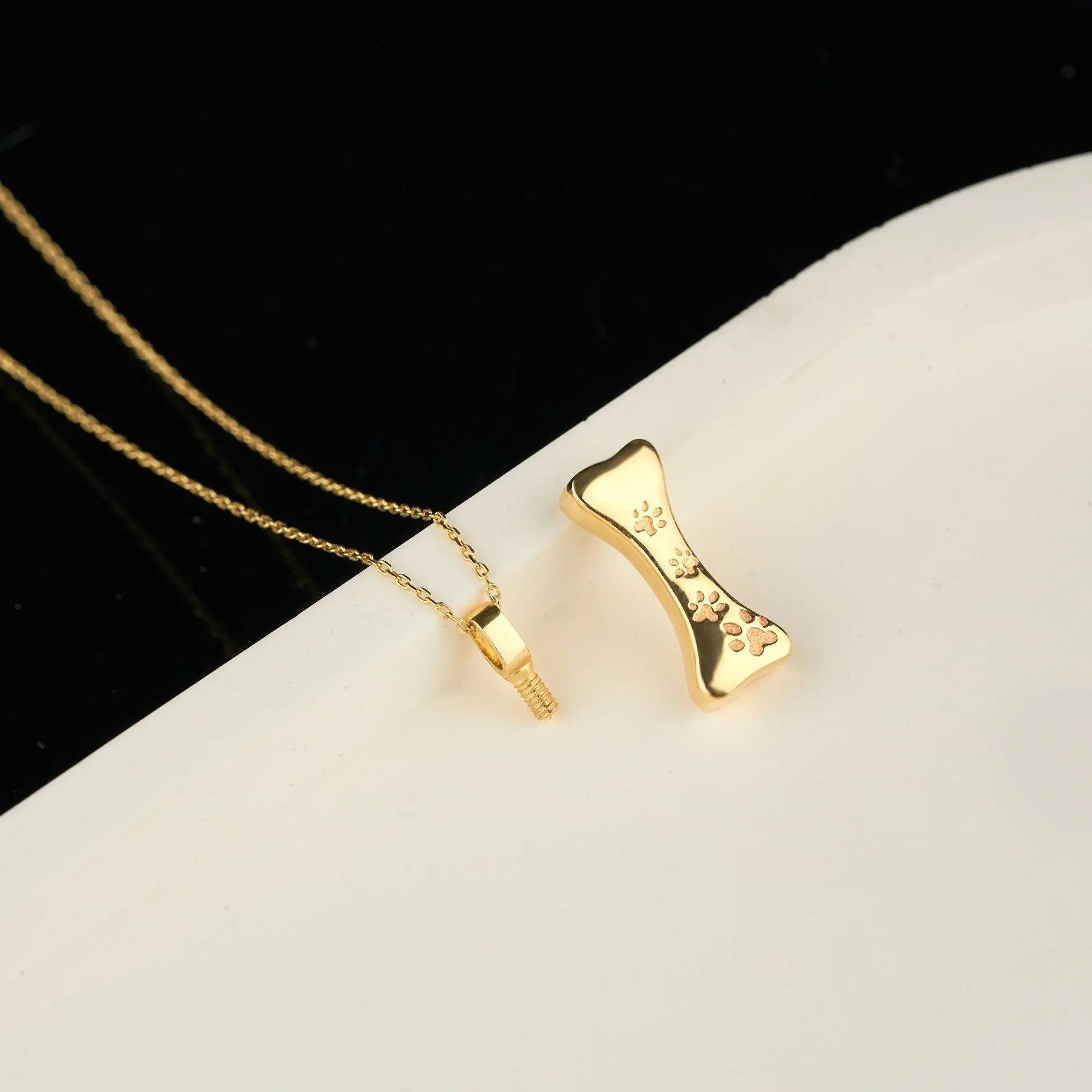 Gold-plated bone pendant necklace for pet cremation, personalized ash holder design