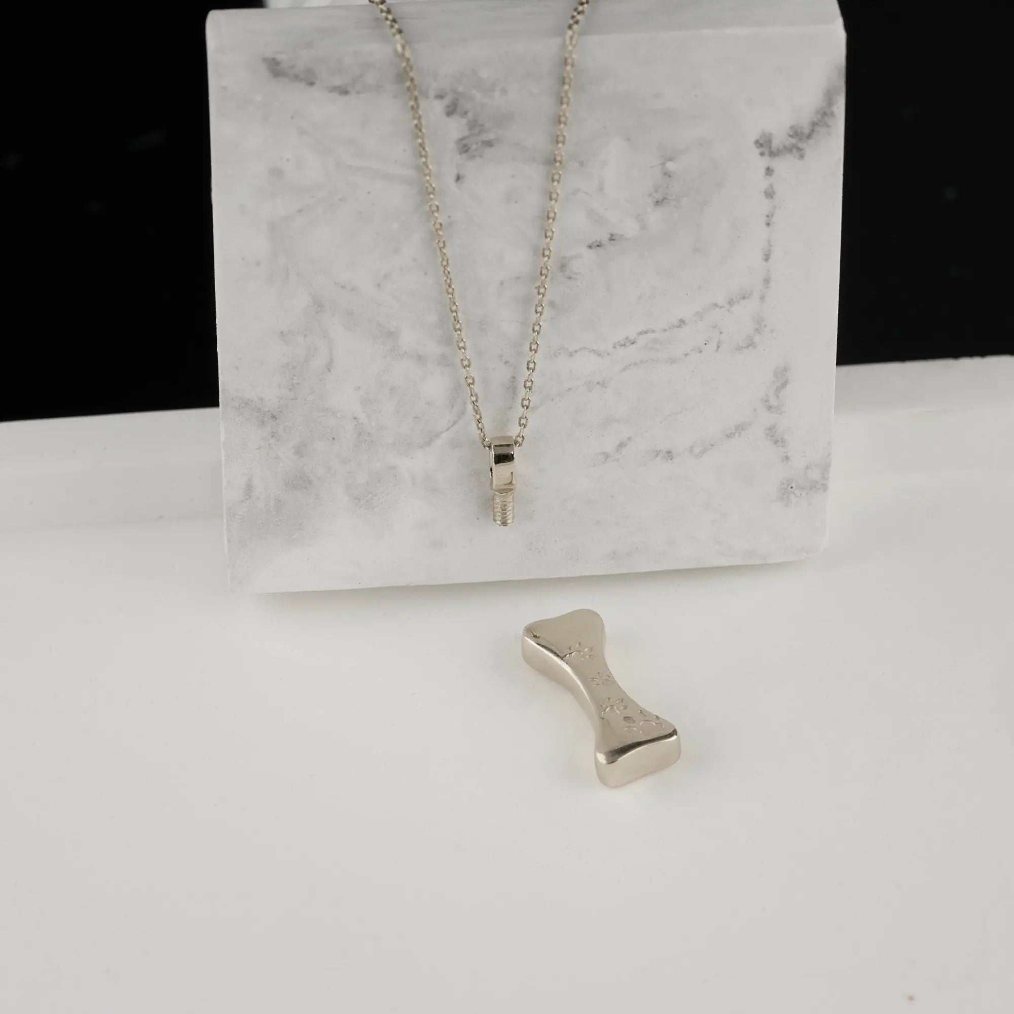 Silver bone pendant on delicate chain for personalized pet cremation jewelry
