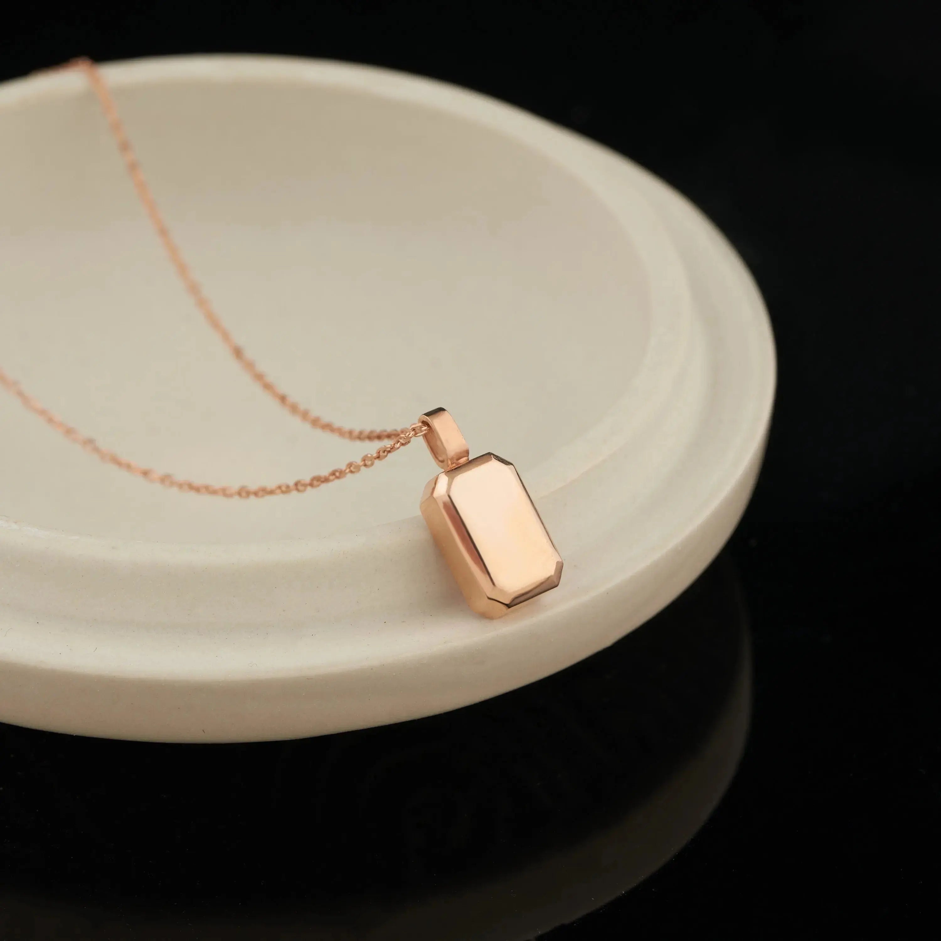 Rose gold geometric pendant necklace on delicate chain, a stunning urn necklace for personalized memorial