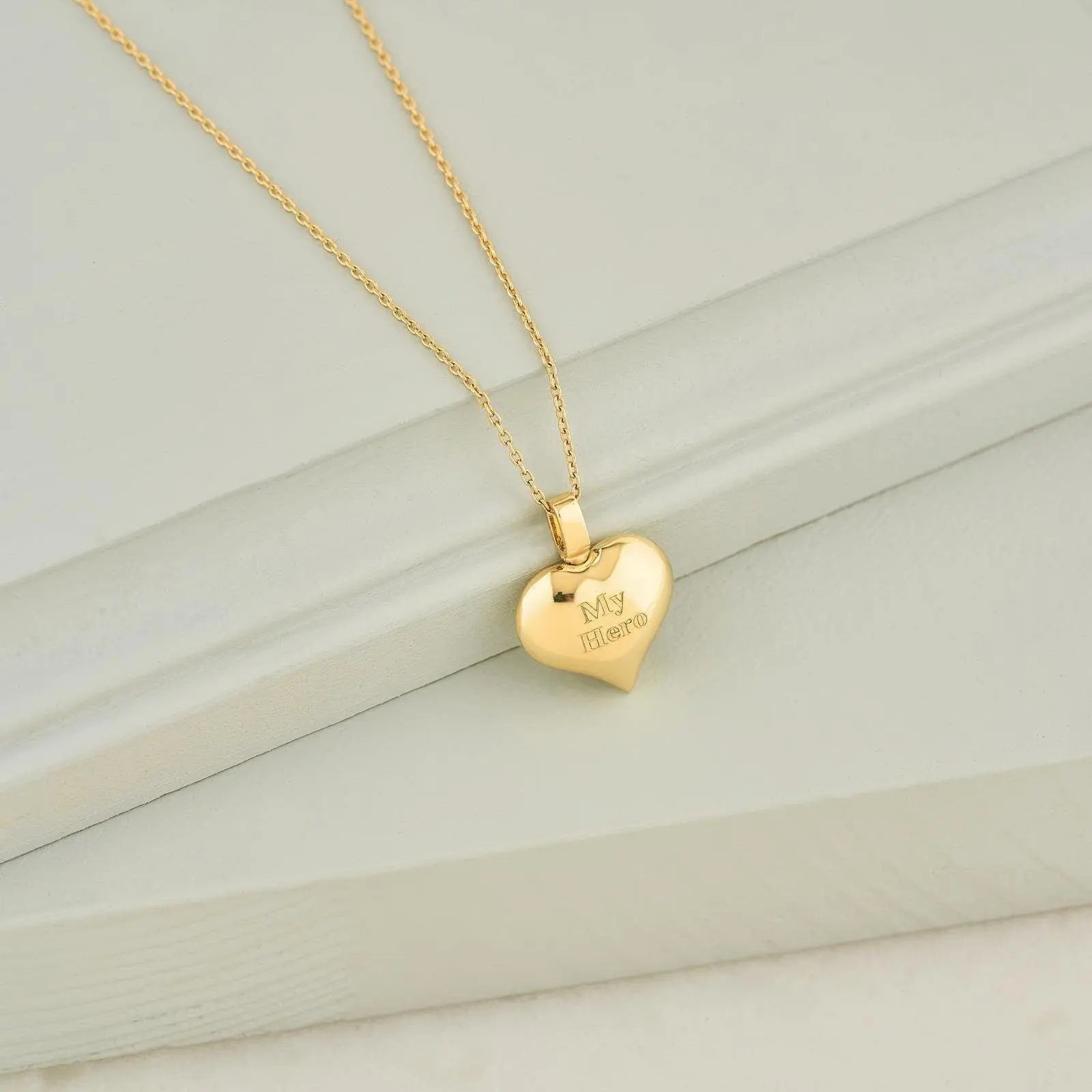 Gold heart-shaped pendant on delicate chain for cremation jewelry urn necklace