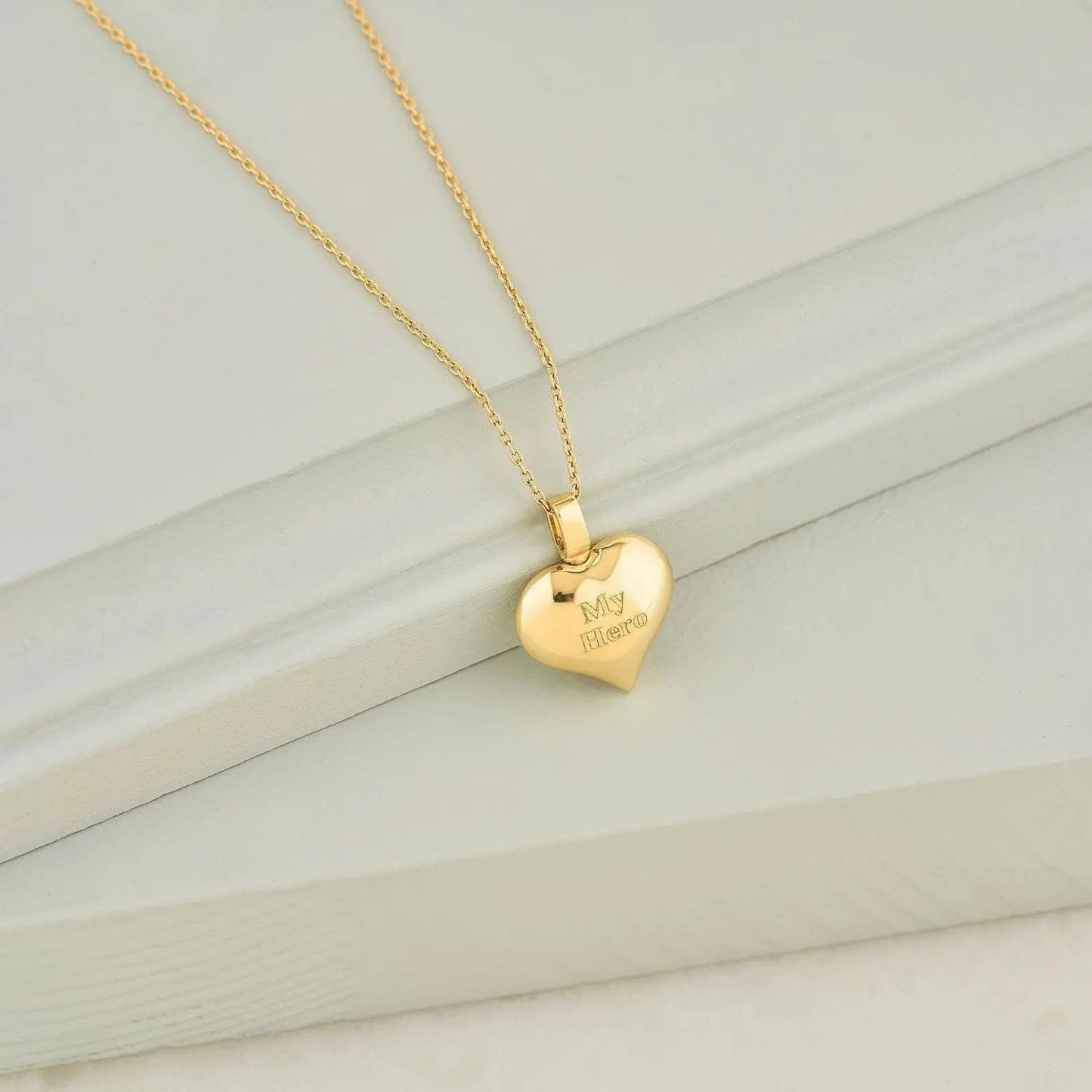Gold heart-shaped pendant on delicate chain for cremation jewelry urn necklace