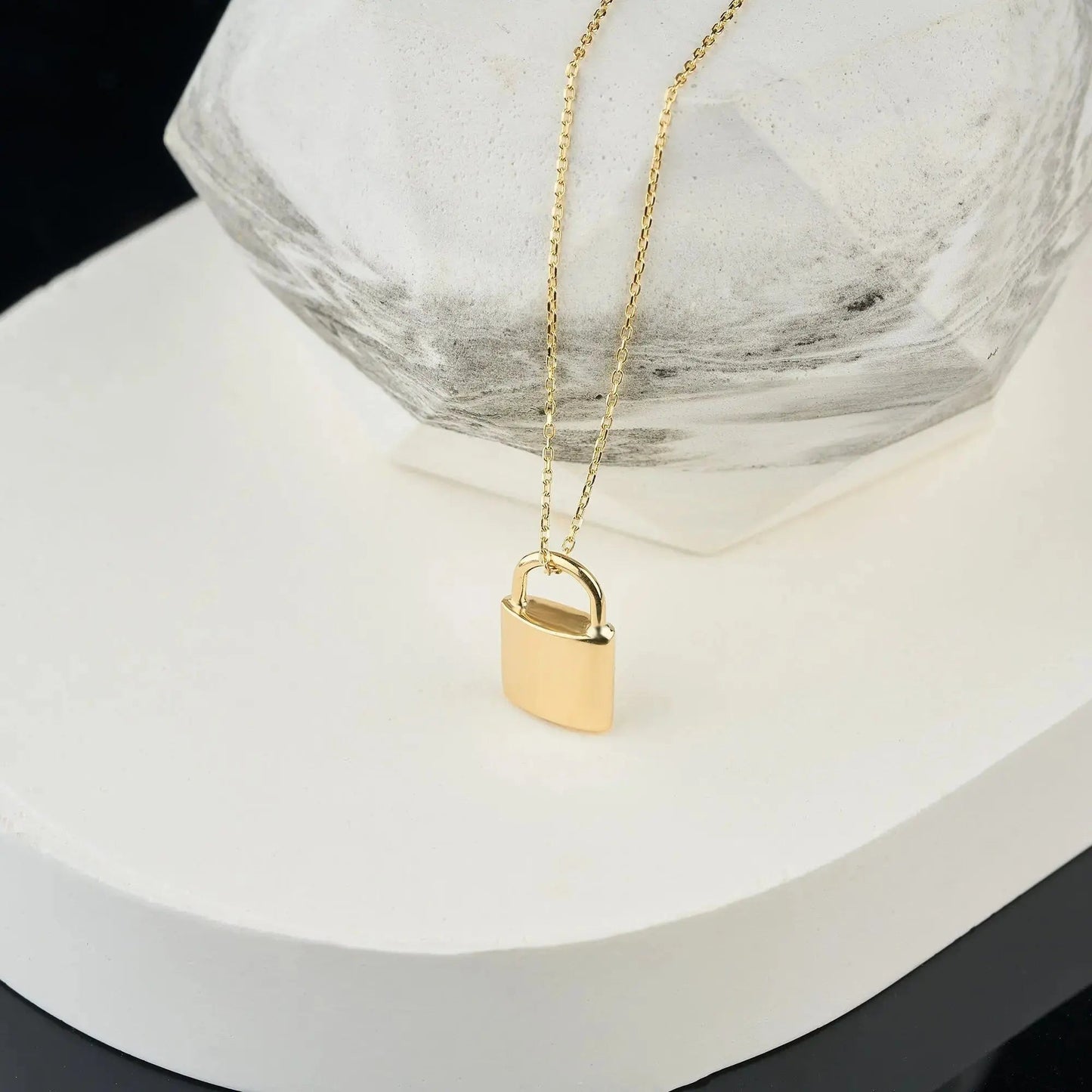 Gold padlock urn necklace on delicate chain, perfect for memorializing loved ones