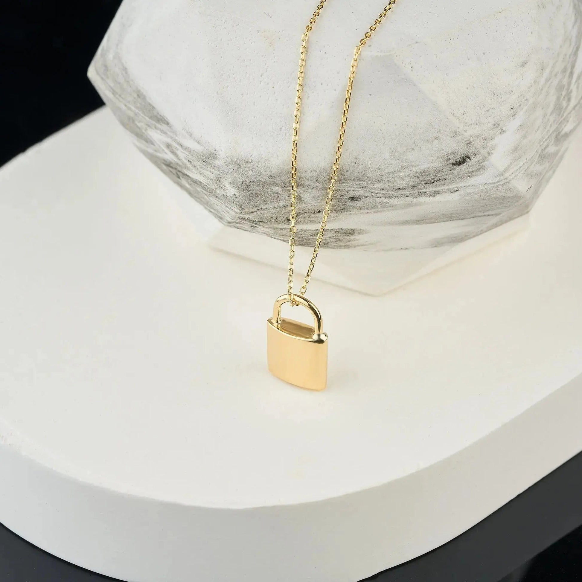 Gold padlock urn necklace on delicate chain, perfect for memorializing loved ones