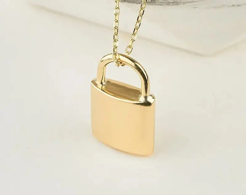 Gold padlock pendant on a delicate chain, perfect for a personalized urn necklace