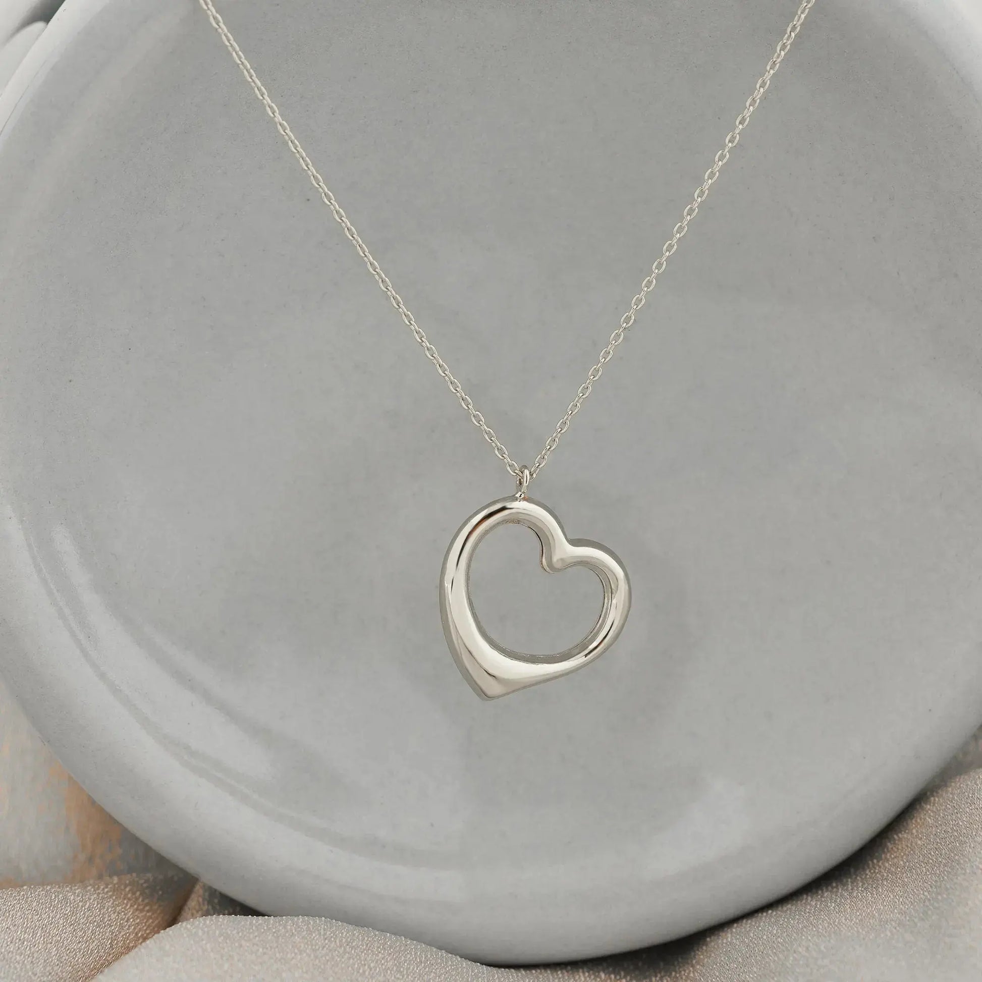 Silver heart pendant on a delicate chain necklace in 14K solid gold, elegant handmade jewelry
