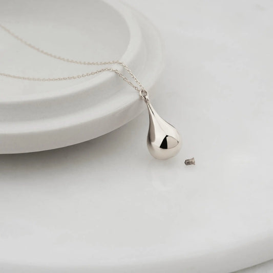Silver teardrop-shaped pendant on a delicate chain necklace for urn jewelry in sterling silver