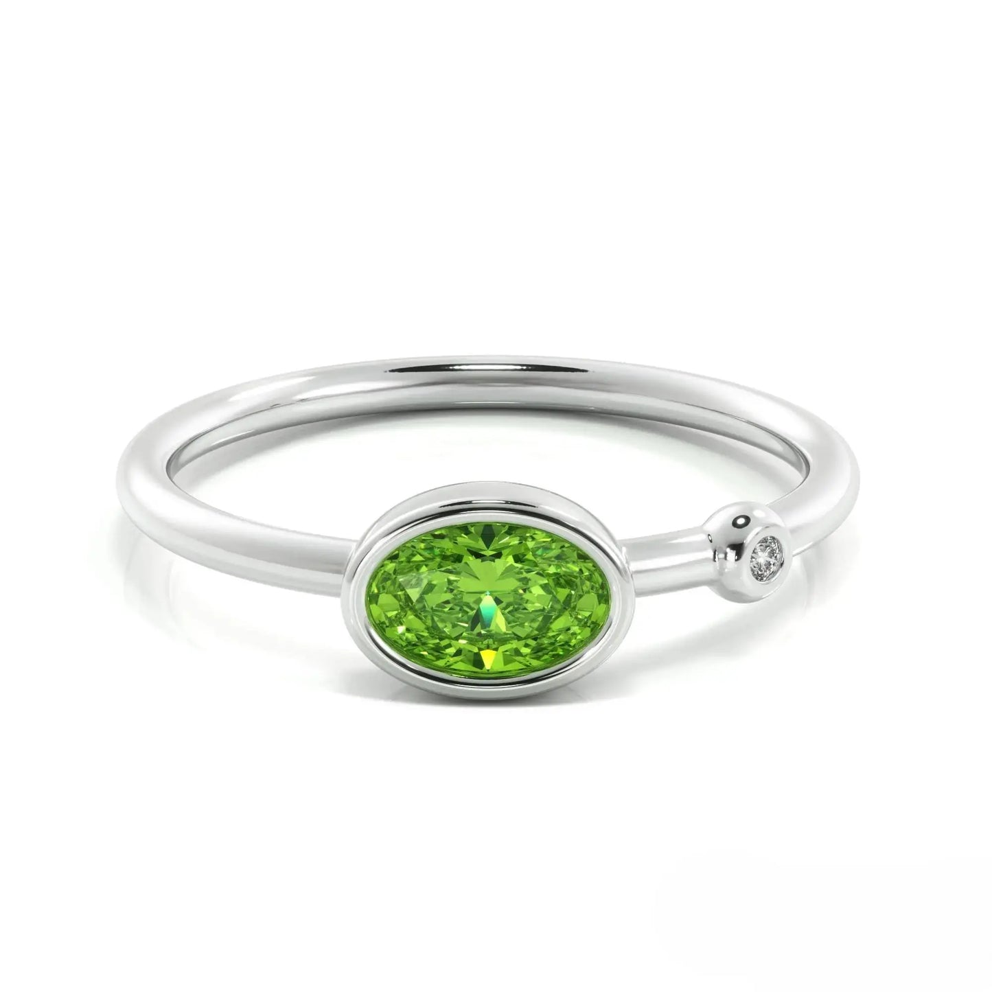 Silver peridot ring featuring an oval peridot gemstone and small diamond accent, August birthstone