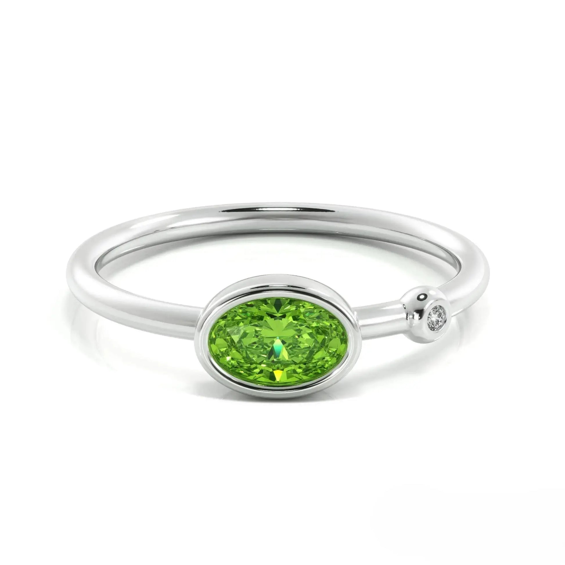 Silver peridot ring featuring an oval peridot gemstone and small diamond accent, August birthstone